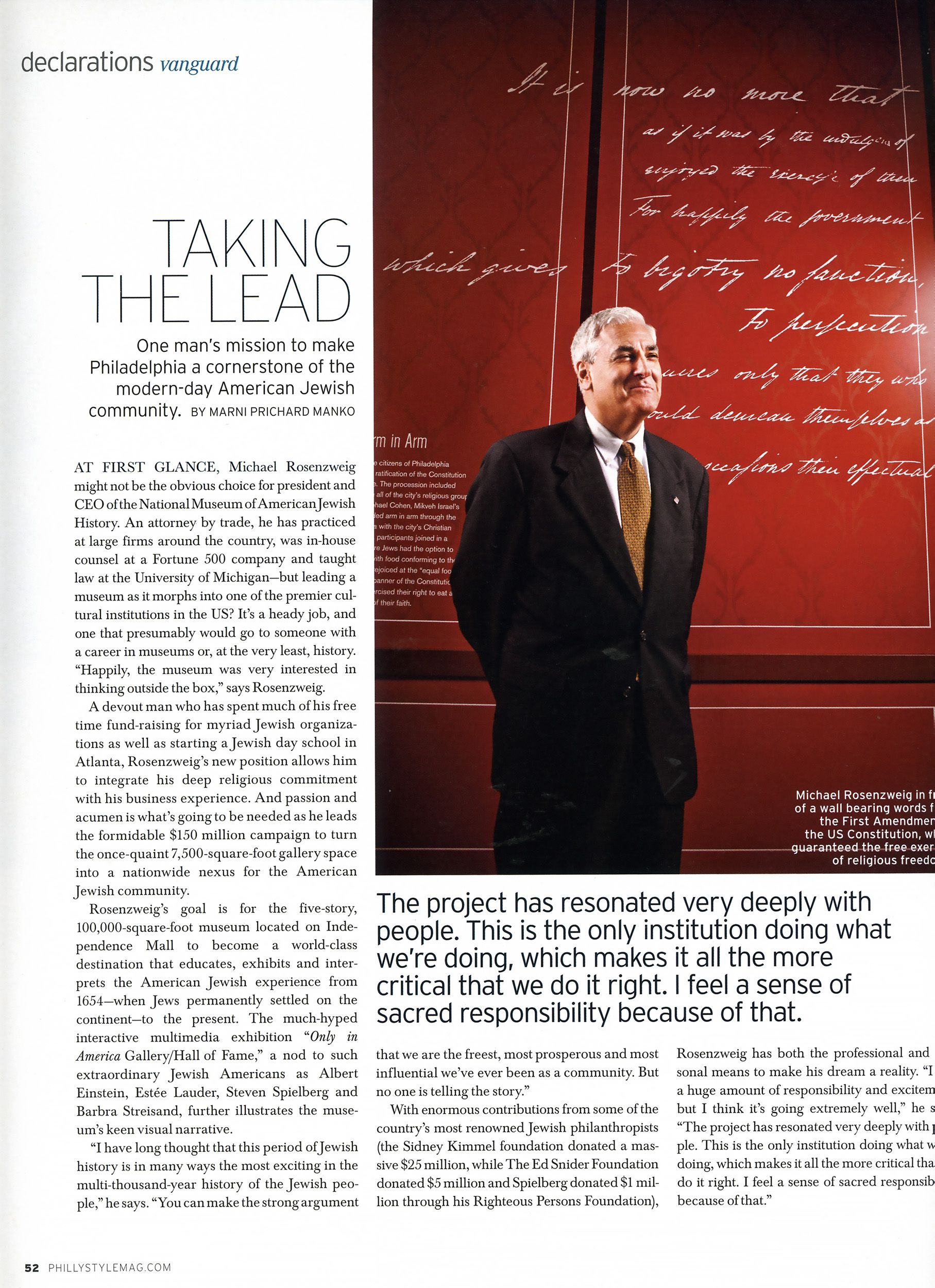 Michael Rosenzweig poses beside the US Constitution for Taking the Lead article about Philadelphia Jewish community.