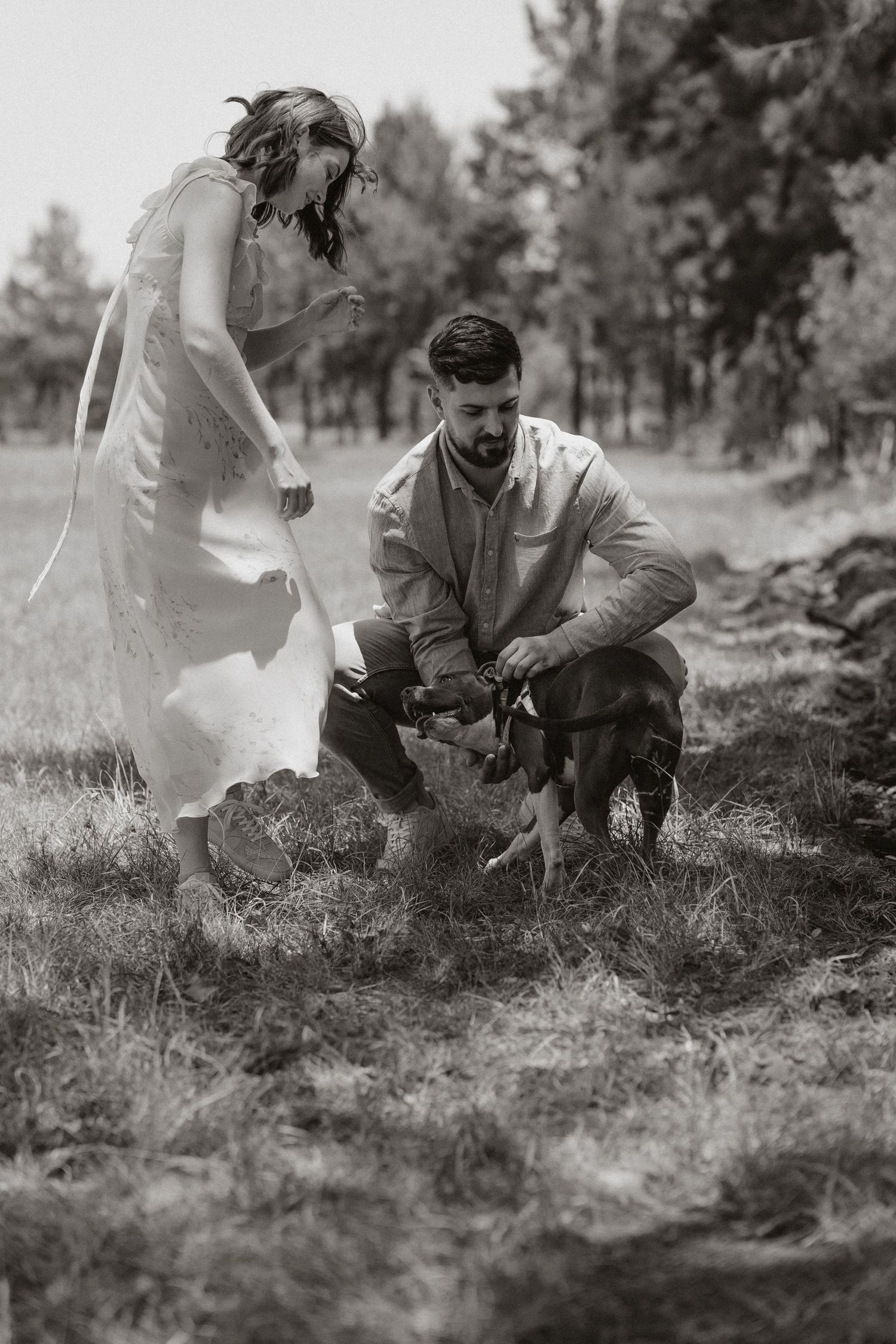 Couple explores nature together in black and white photography.