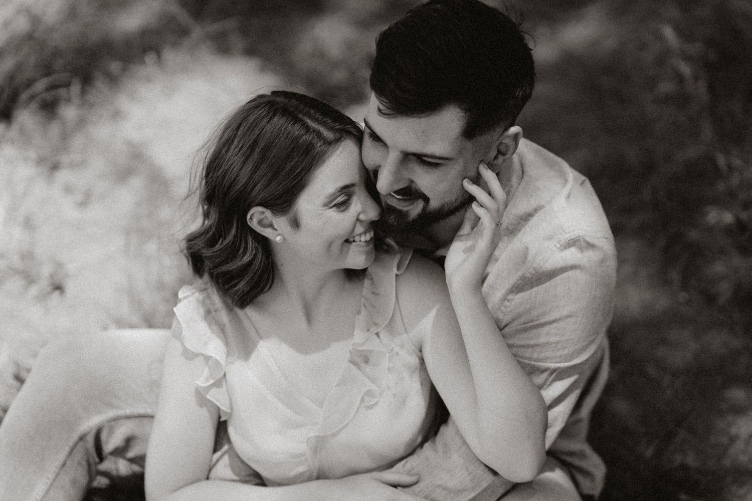 Romantic black and white portraits showing tender embraces between a couple.