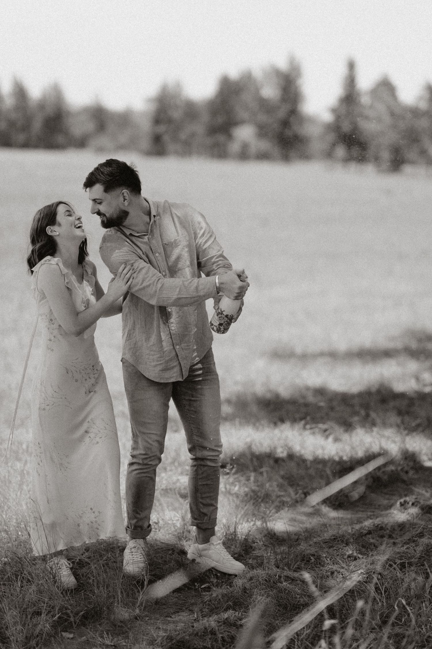 A romantic vintage black and white photo sequence showing a couple sharing tender moments in a field.