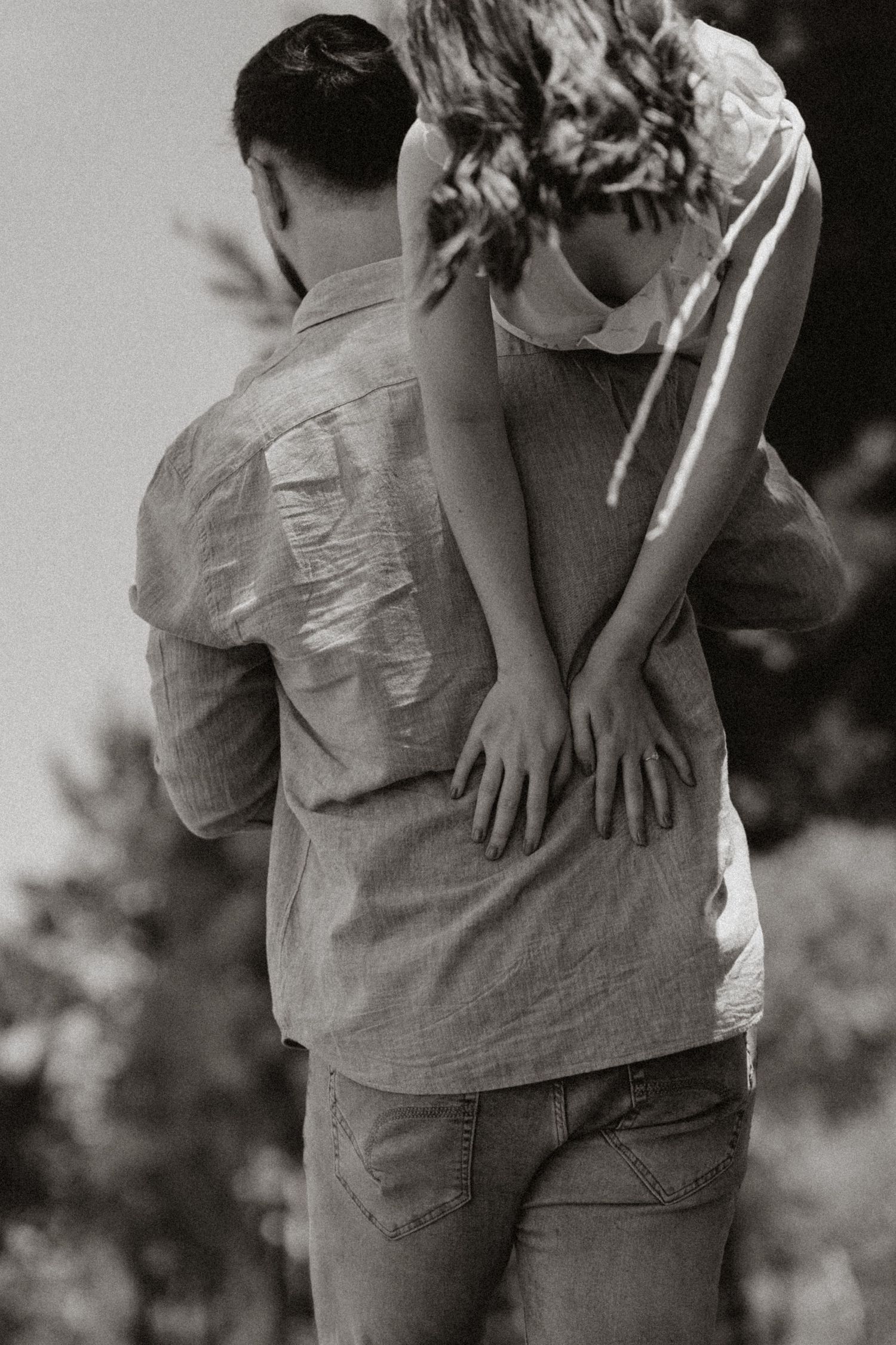 Black and white intimate sequence showing close embraces and tender moments.