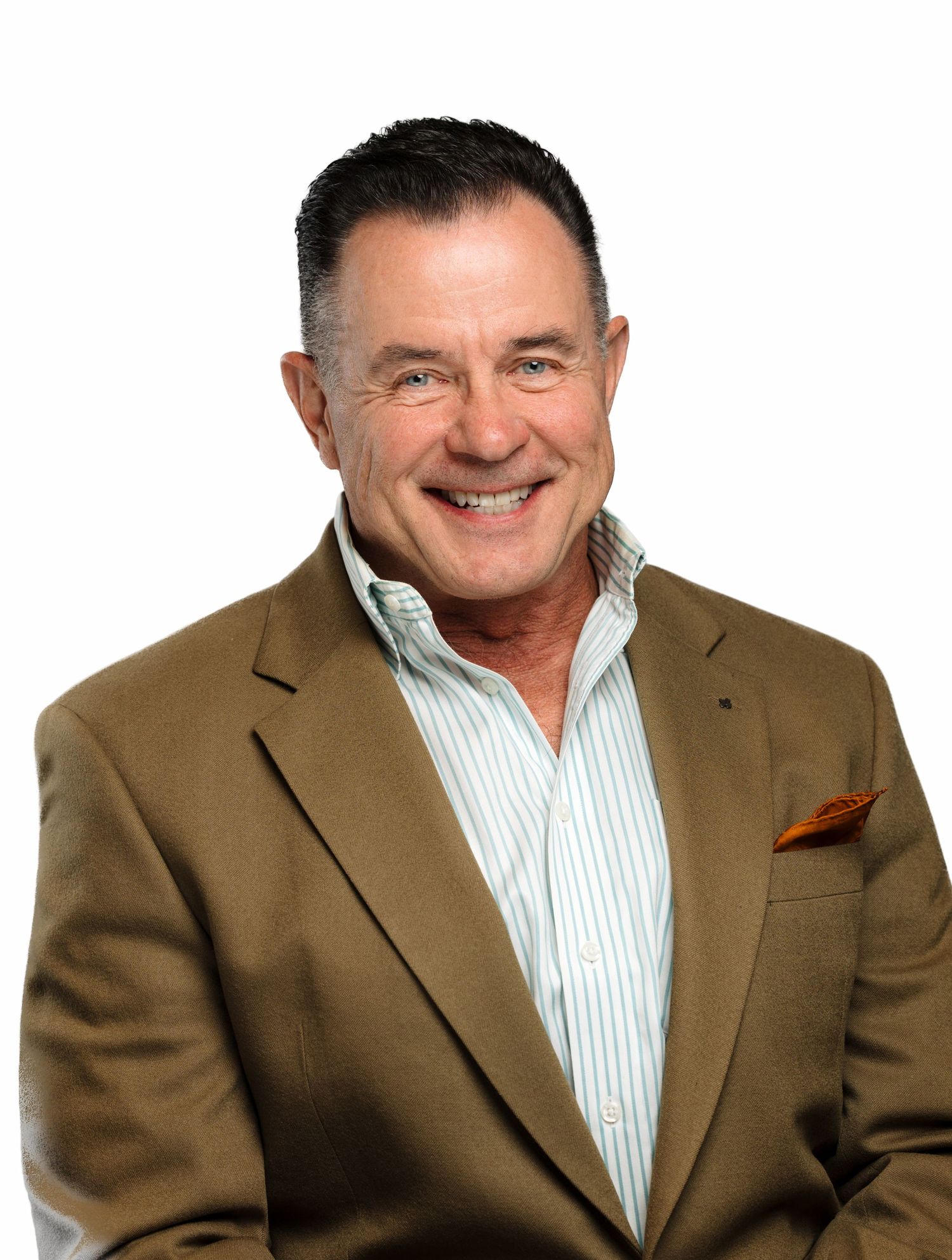 Professional headshot of a person wearing a brown blazer, striped dress shirt and orange pocket square against white background.
