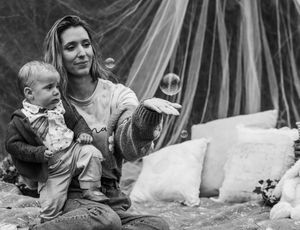 Mother and baby playing with bubbles