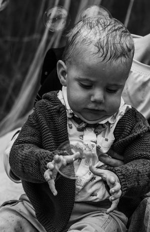A toddler with a bubble