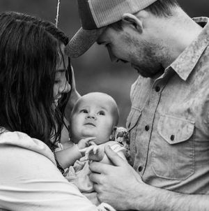 Mum and dad gaze at their baby