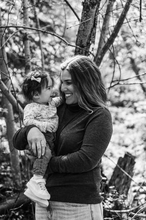 A mother and her baby in the woods