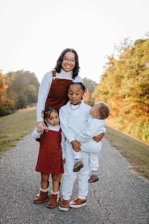 A series of candid family photos showing sweet interactions between siblings on a gravel path during golden hour.