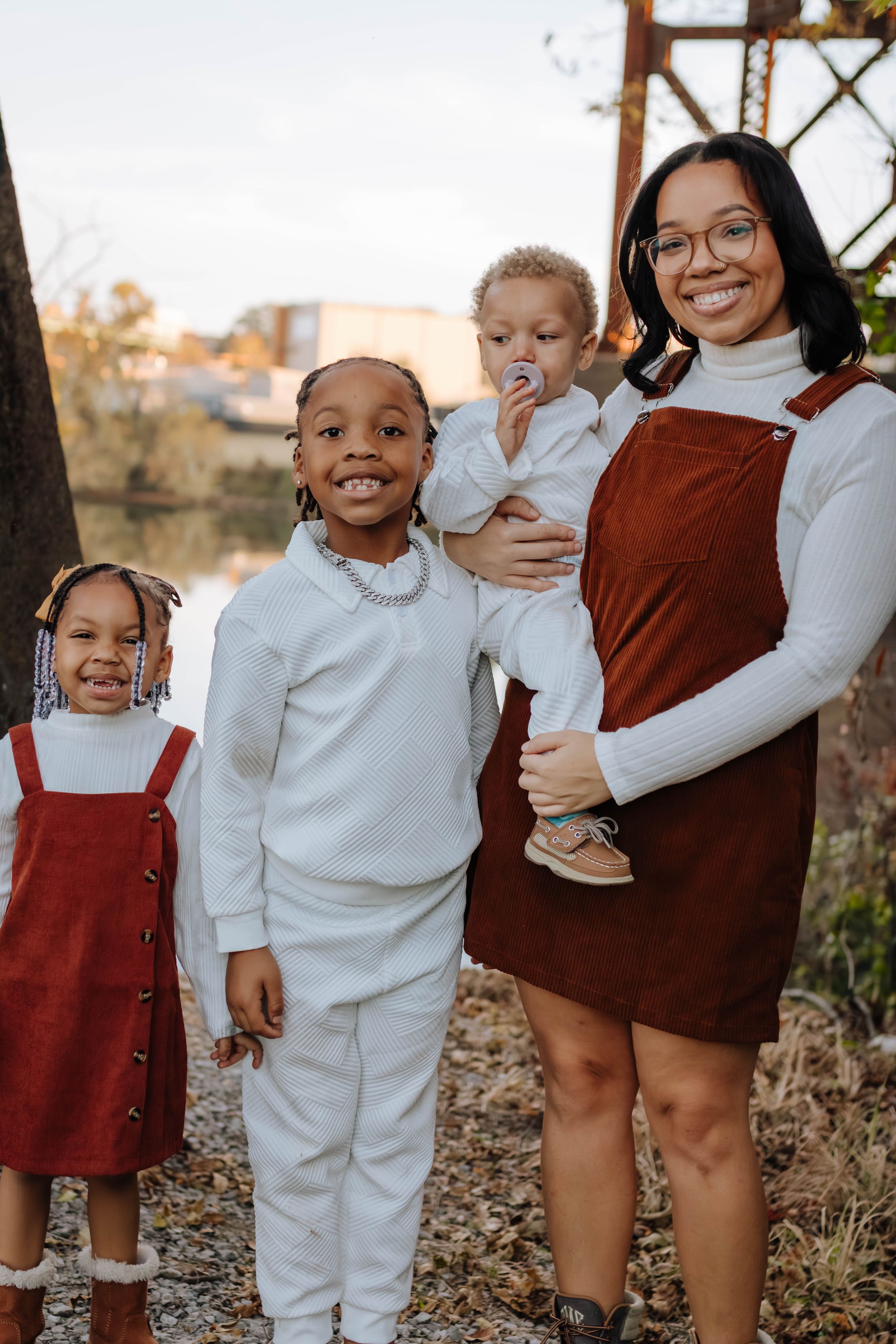 A collection of candid family photos showing joyful moments outdoors in coordinated burgundy and white outfits.