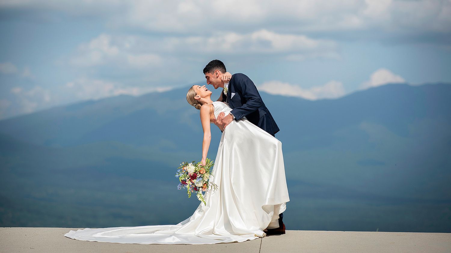 Bride and groom posing on Mountaintop at Mt. Washington.