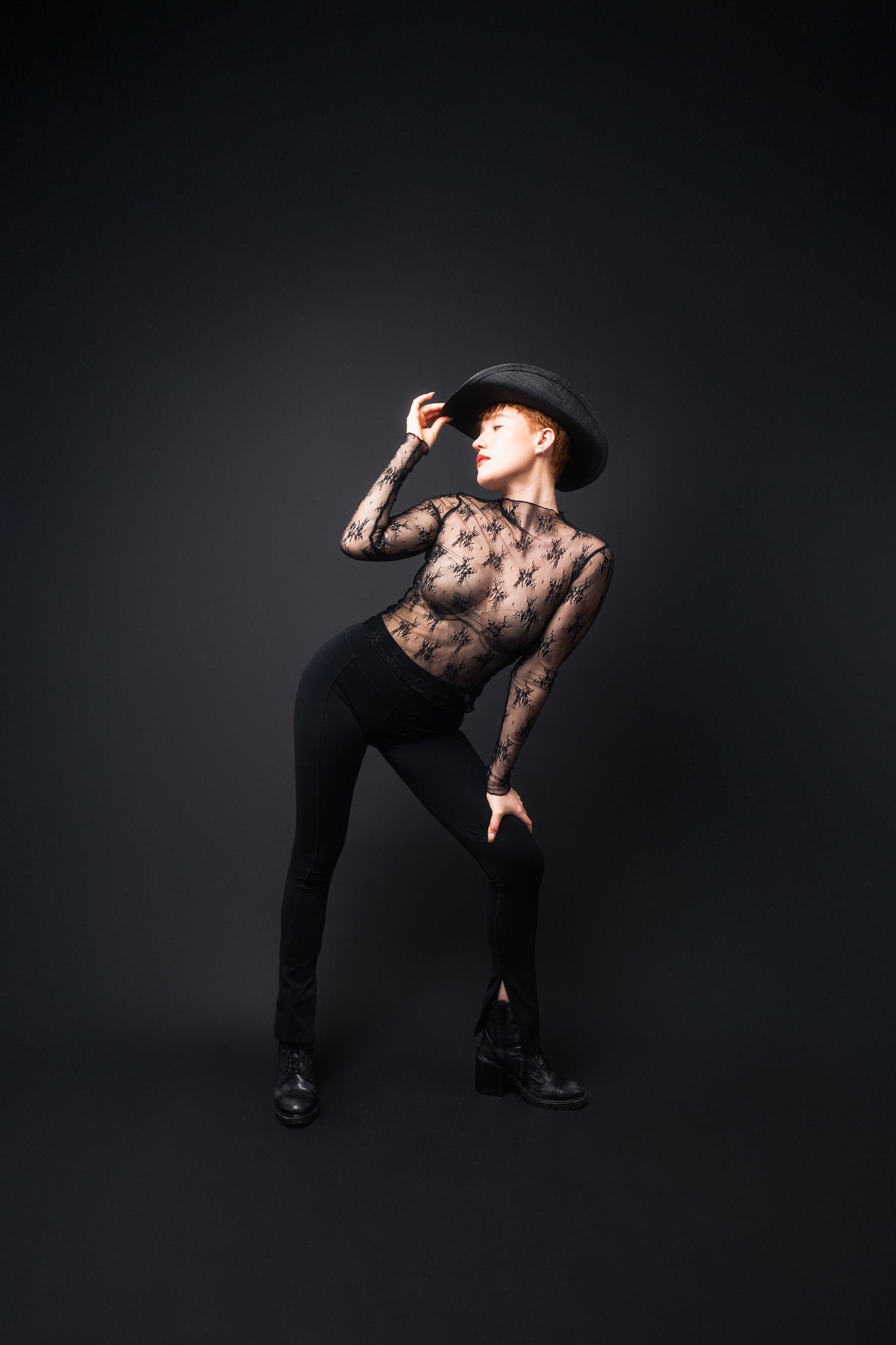 Dynamic dance poses captured against dark background in black attire.