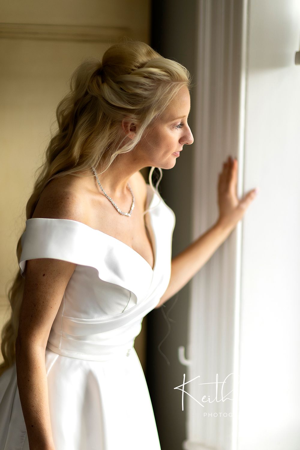 Beautiful Bride gazing out of window at Shuttle Hall Derbyshire