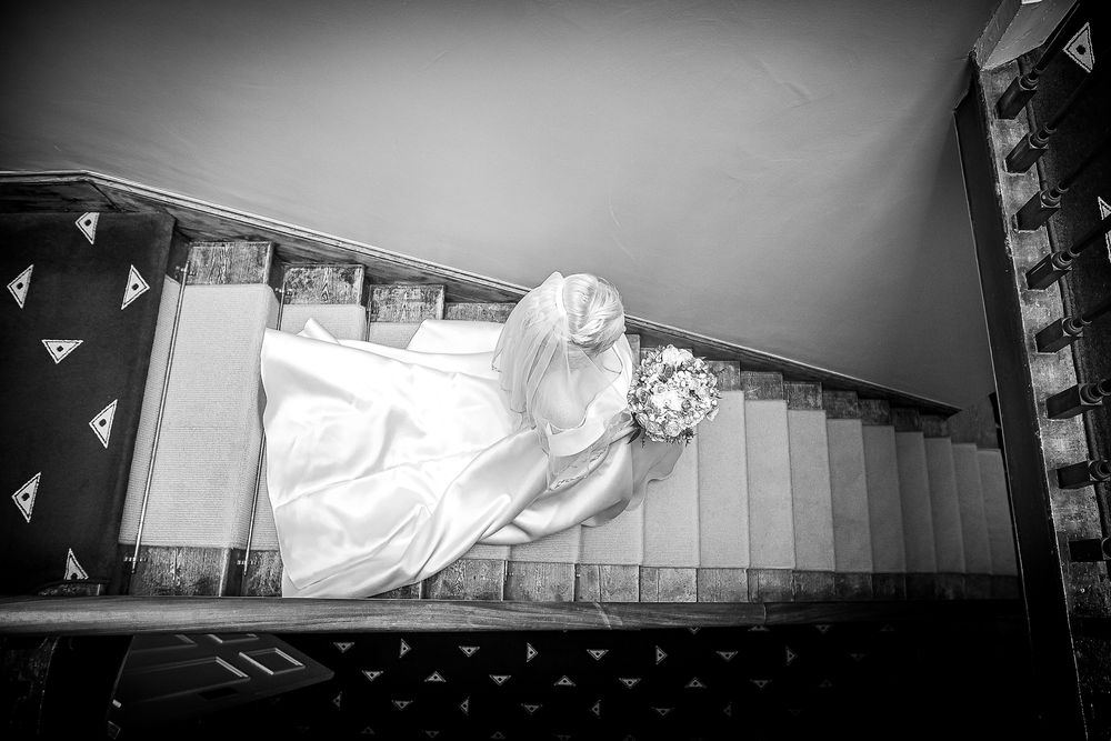 Bride walking downstairs at Shottle Hall Derbyshire