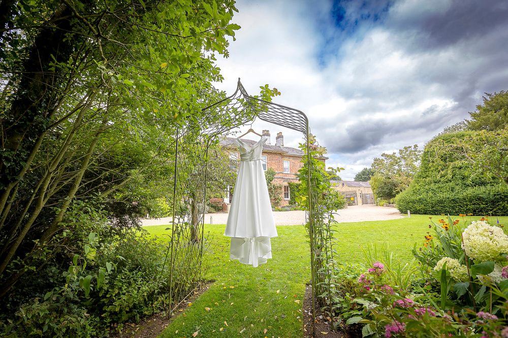 Wedding dress hanging outside at Shottle Hall Derbyshire