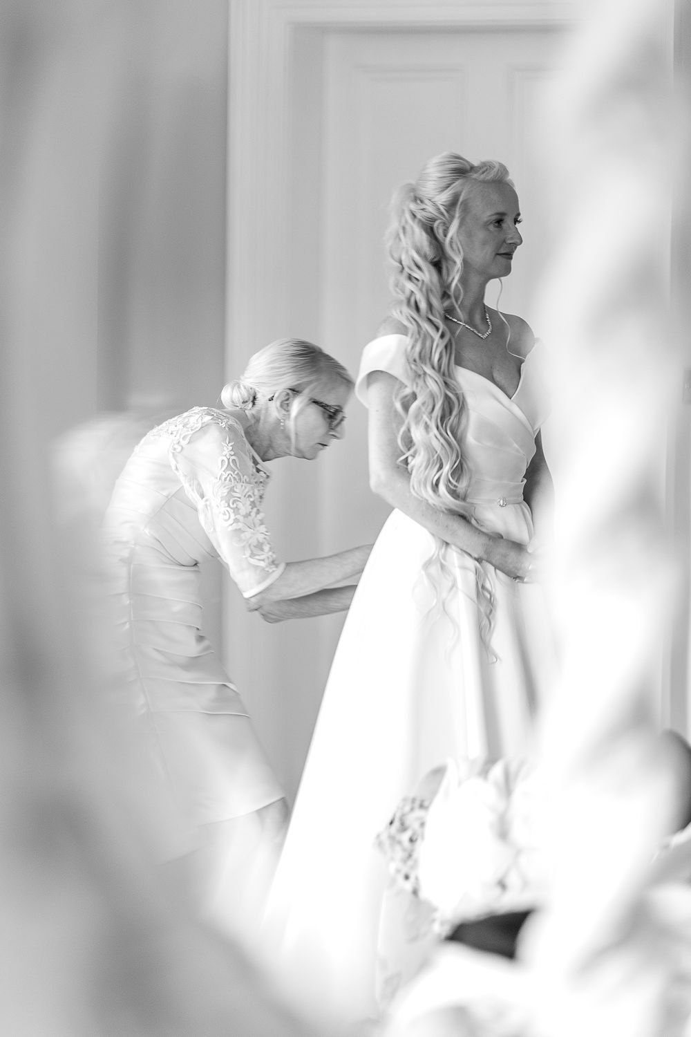 Mum fastening wedding dress at Shottle Hall Derbyshire