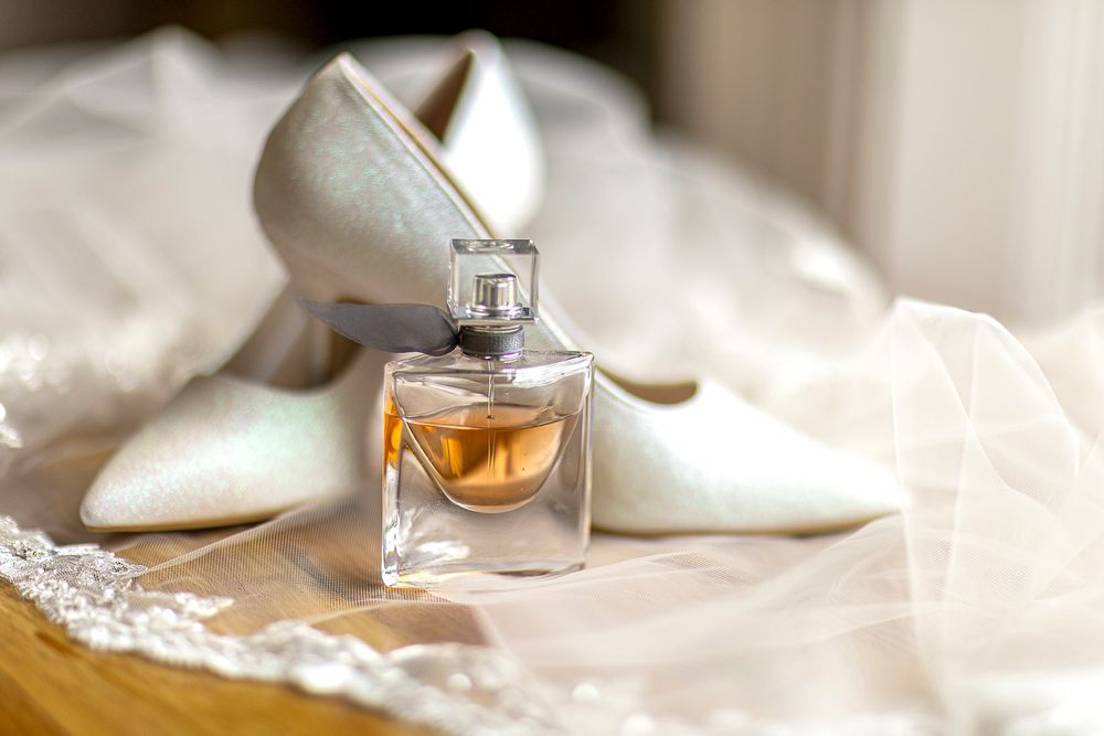 Bride's shoes with perfume at Shottle Hall Derbyshire