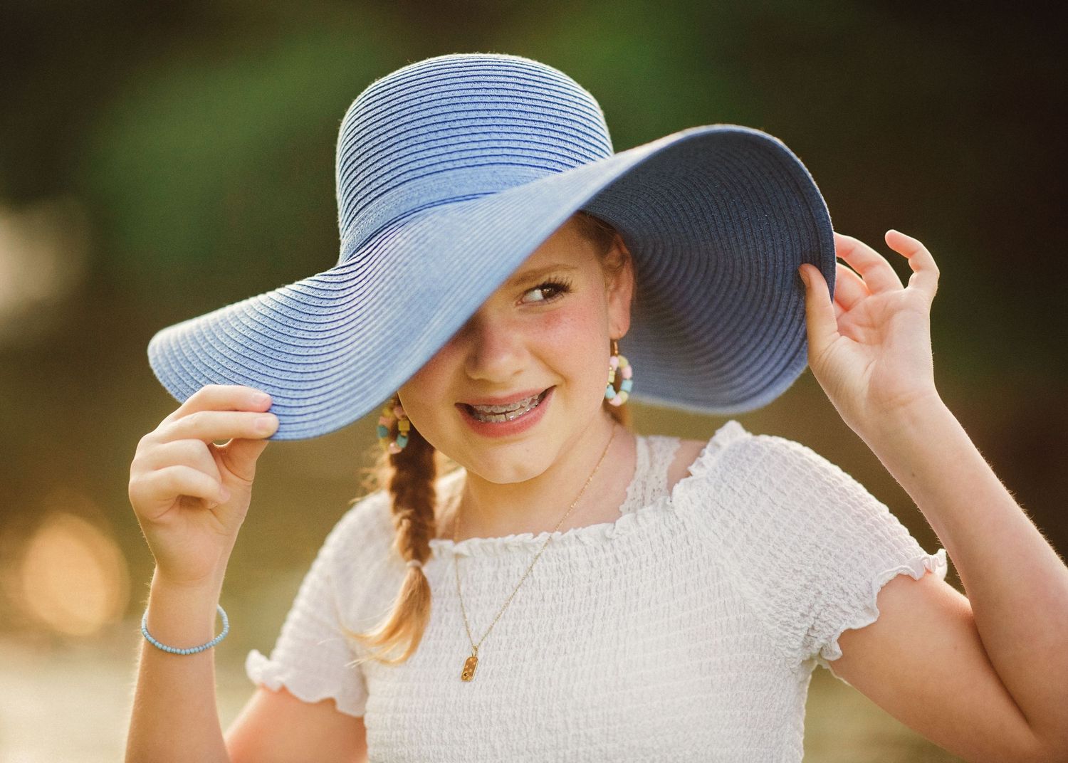 Stunning image of young girl in a blue hat