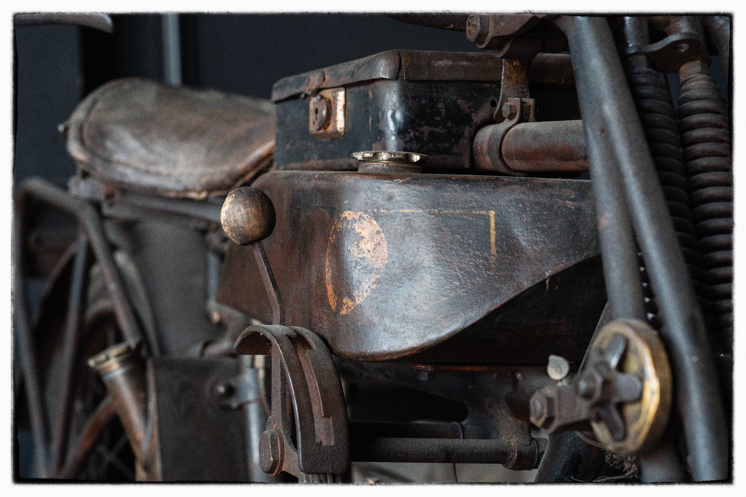 Detailed view of rustic motorcycle engine components and mechanics.