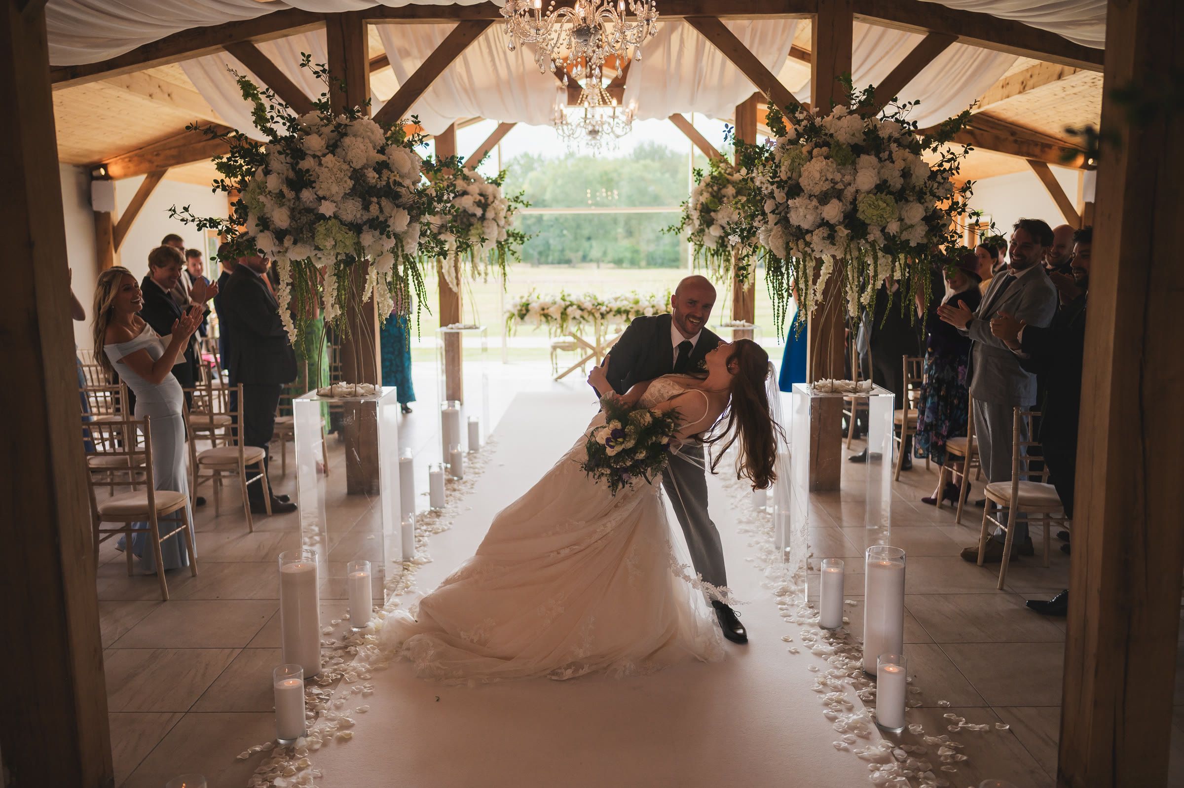 Charlotte and Niall kiss after the ceremony, Merrydale Manor wedding photography