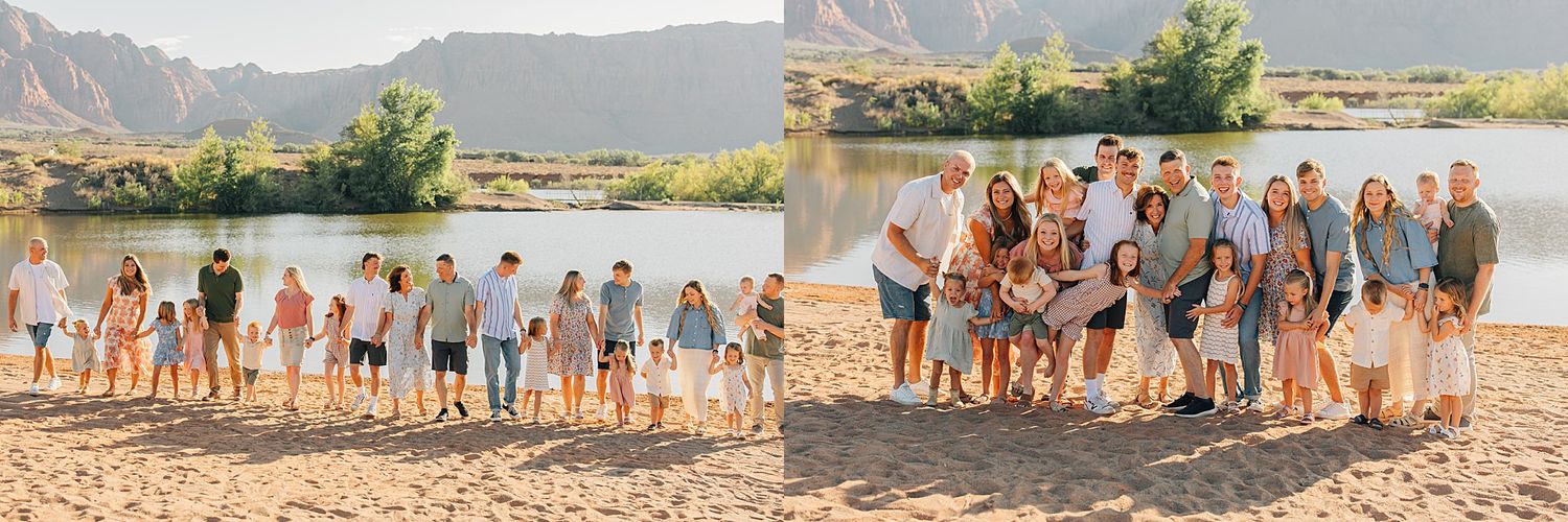 Large extended family group portrait on sandy beach with lake and mountain backdrop in coordinating blue and white outfits.