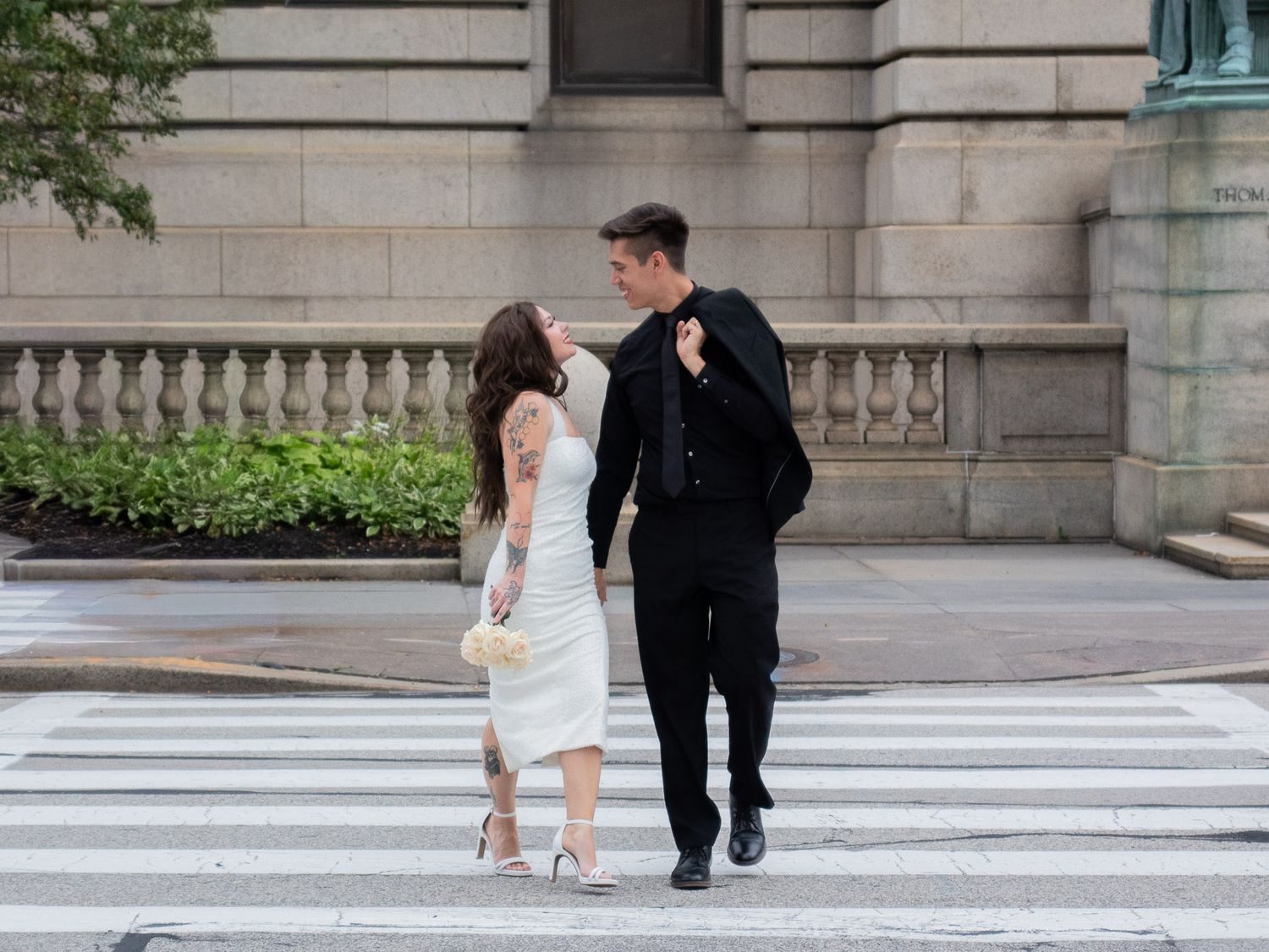 Strongsville elopement, bride and groom crossing the street in the city