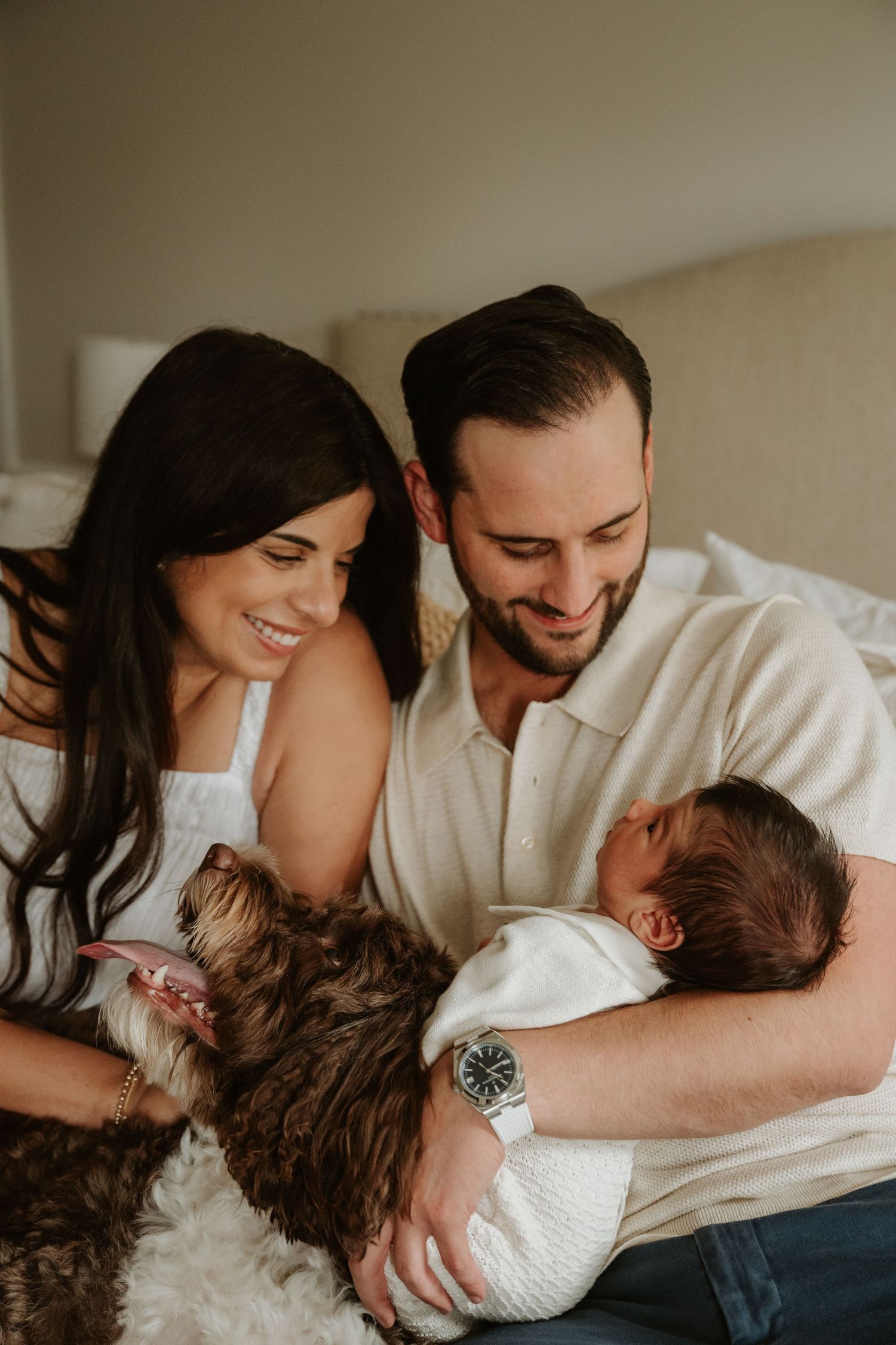 Family of four cuddling on an in home session in bed in Westfield, NJ