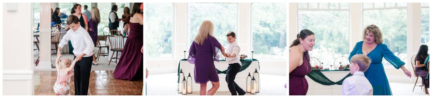 Guests dancing and celebrating joyfully at colorful wedding reception in bright elegant venue.