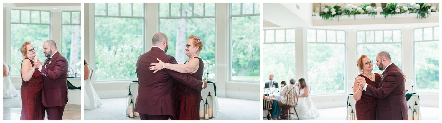 Bride and groom share a tender moment during their first dance in a bright, window-lined wedding reception venue.