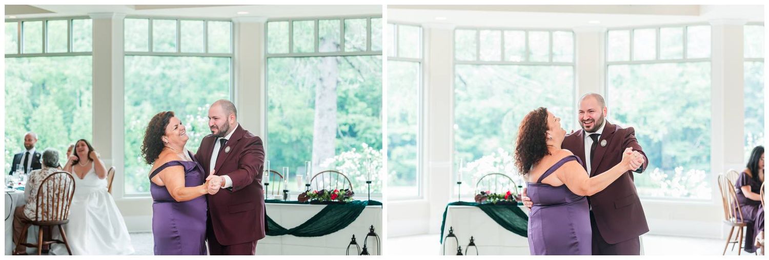 Groom dancing with his mother in an elegant white reception hall during a wedding celebration.