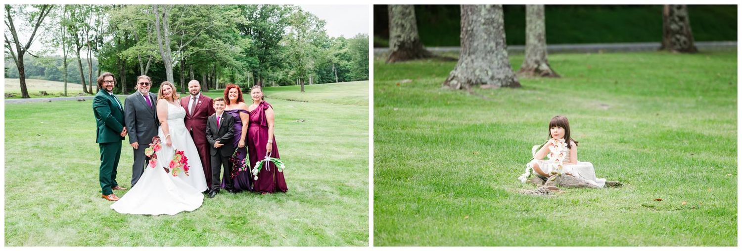 Wedding party group photo on lush green grass with bride in white gown and colorful bridal party.