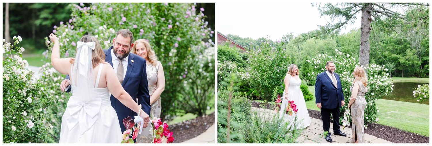 Bride and groom walking through a lush garden with wedding guests during an outdoor ceremony.