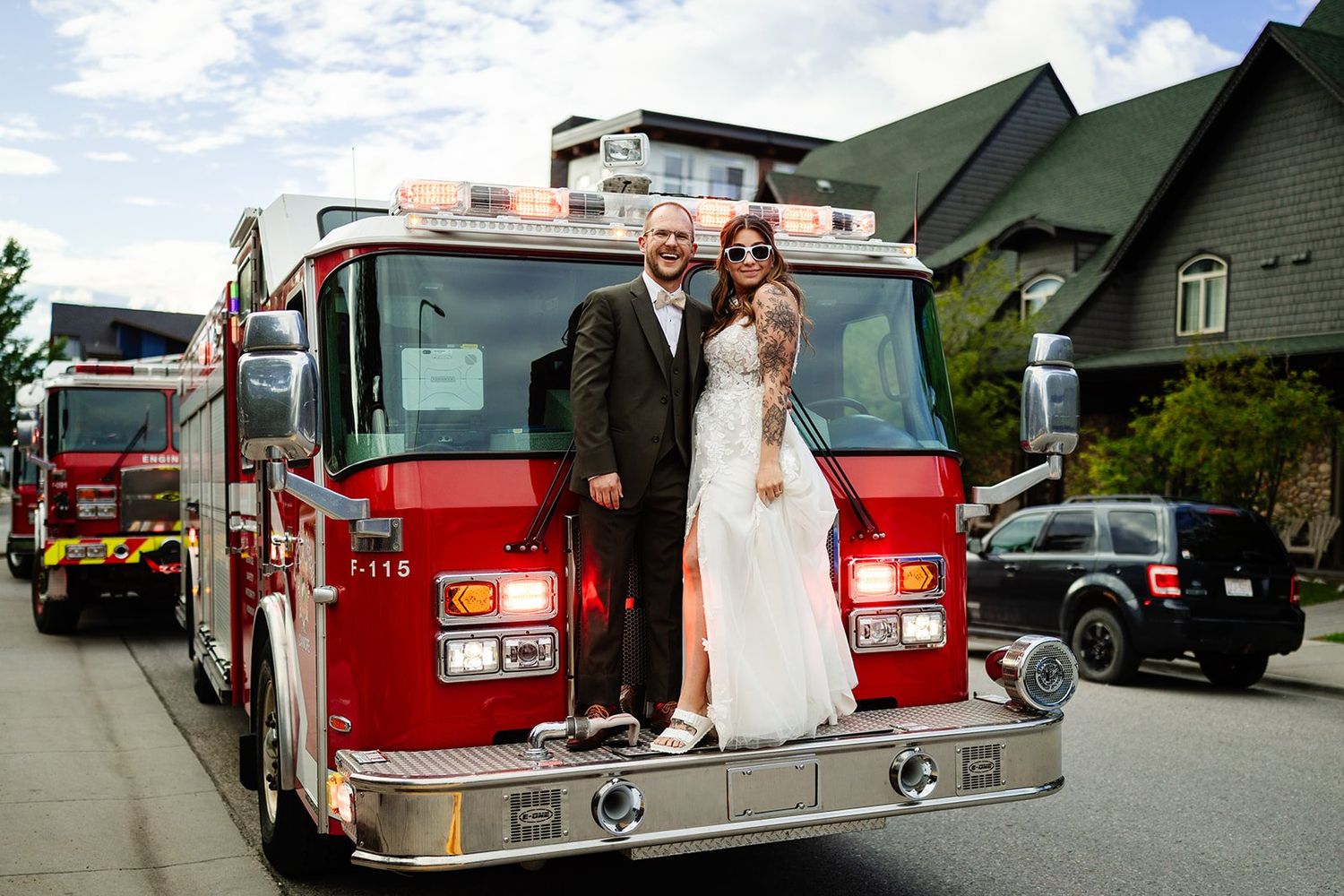 Christina, the fire bride, composed and radiant with Bryce on a fire truck after their wedding day fire