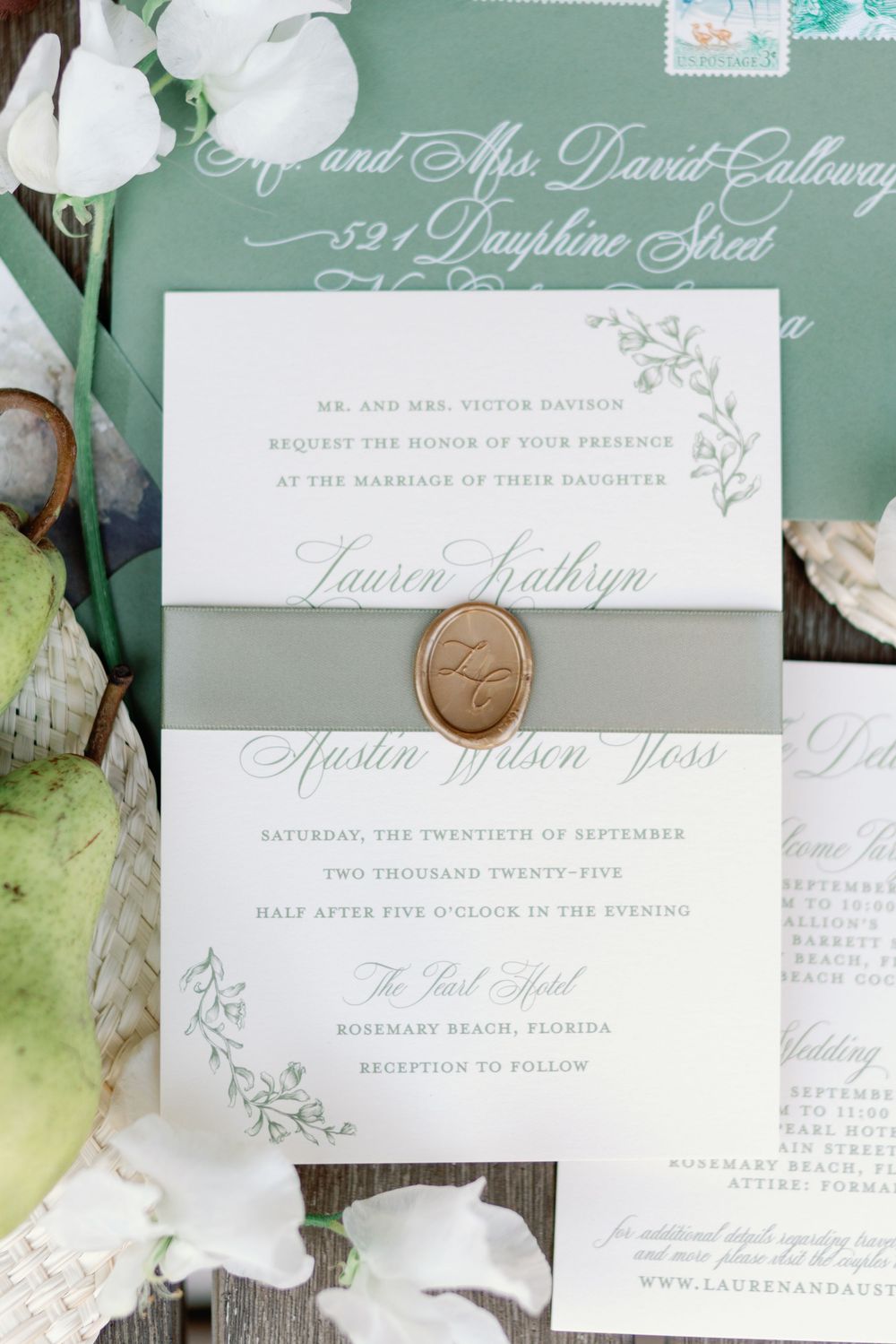 Elegant wedding invitation suite with sage green ribbon, gold wax seal, and botanical details for a Rosemary Beach Florida wedding.