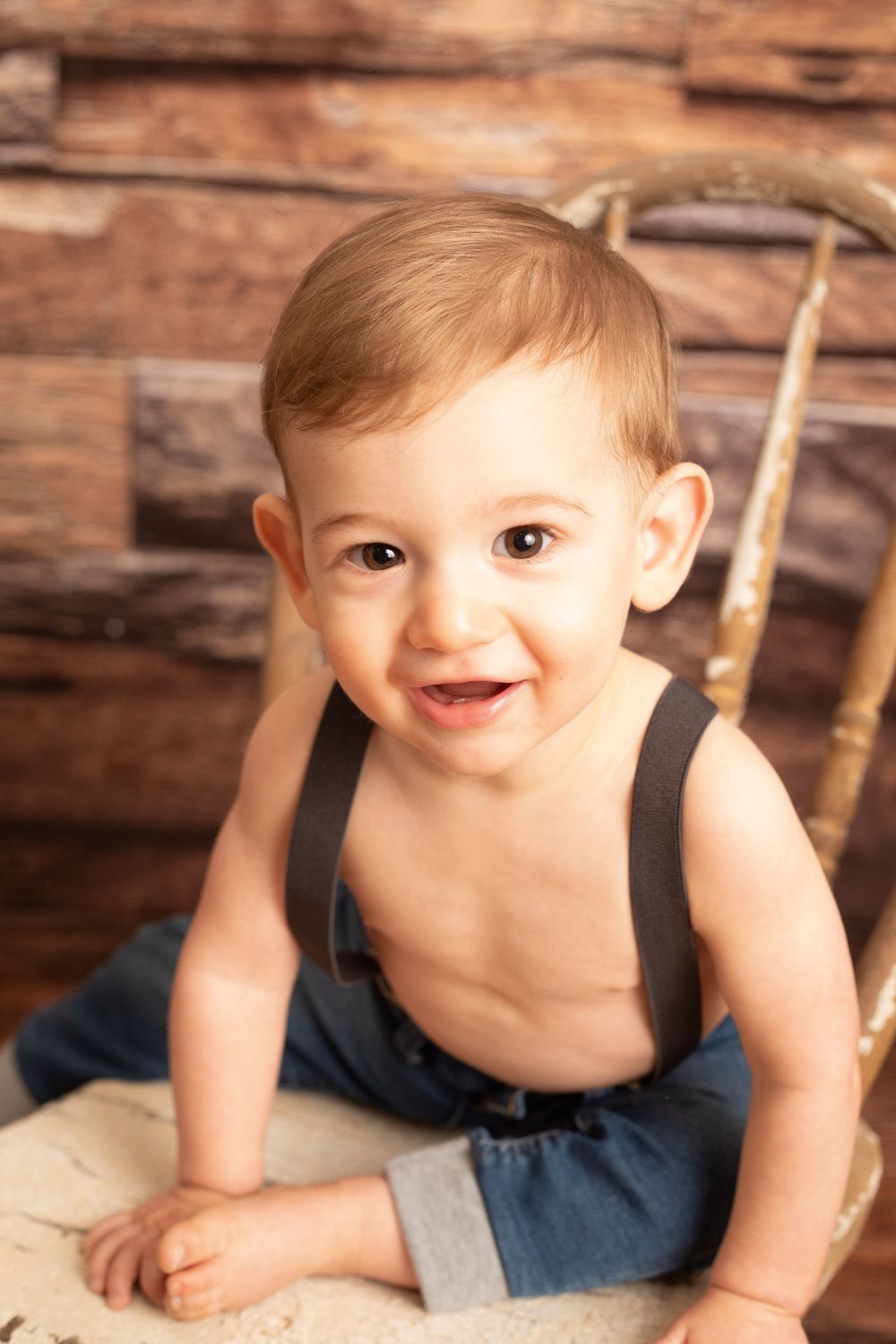 Smiling baby photographed during a milestone session in Central Louisiana.