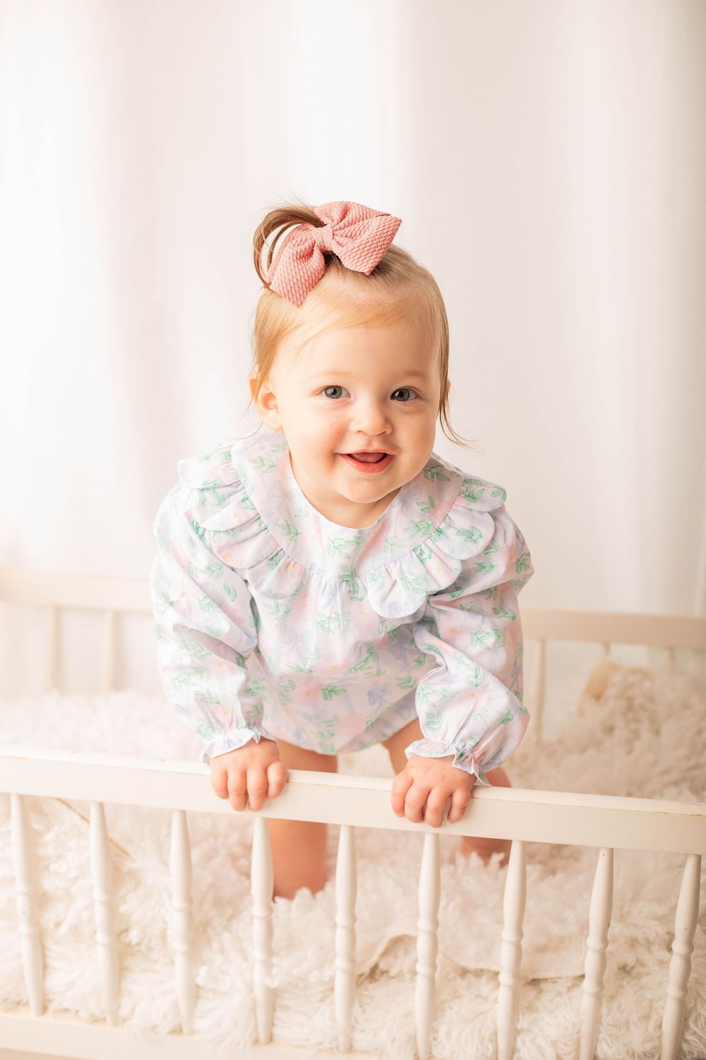 Smiling baby photographed during a milestone session in Central Louisiana.
