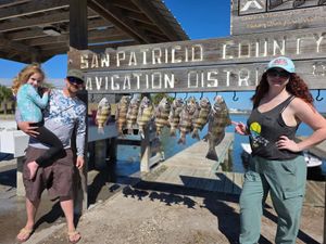 Family displays their sheepshead catch at San Patricio County Navigation District fishing pier in Texas.