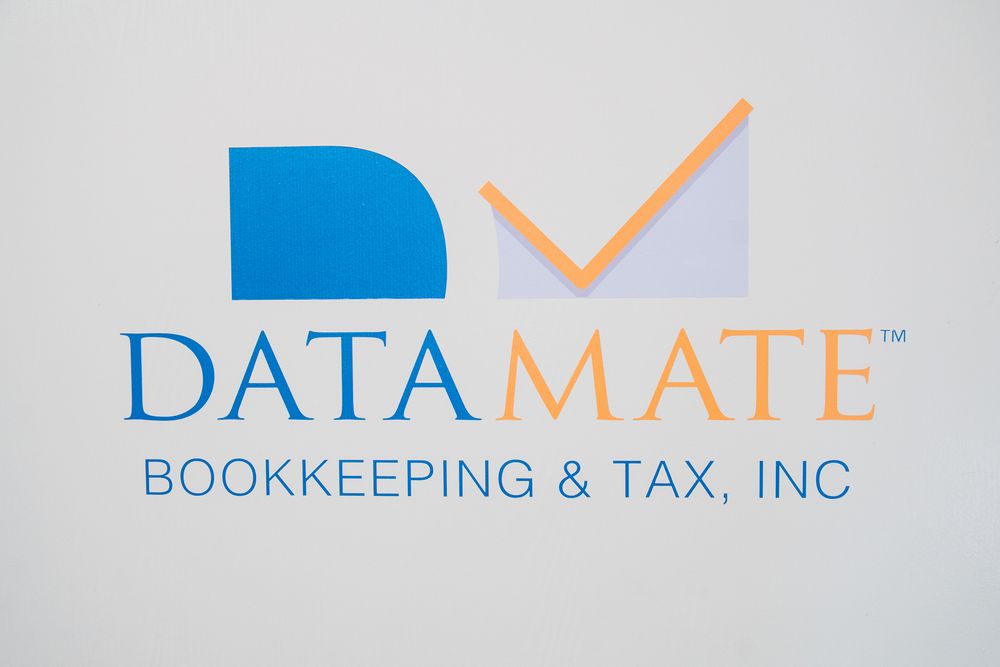 DataMate Bookkeeping & Tax, Inc. company logo featuring blue and orange colors on a white background.