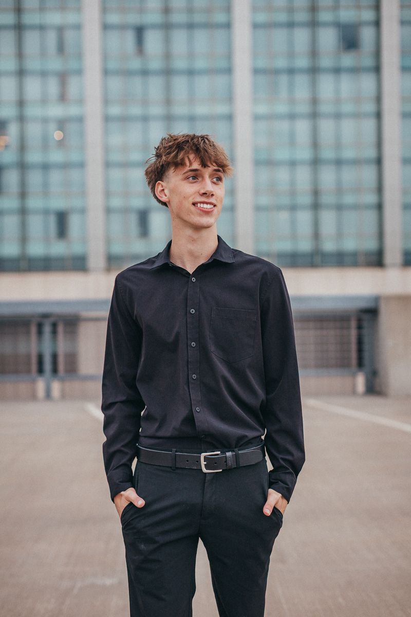 boy in front of building