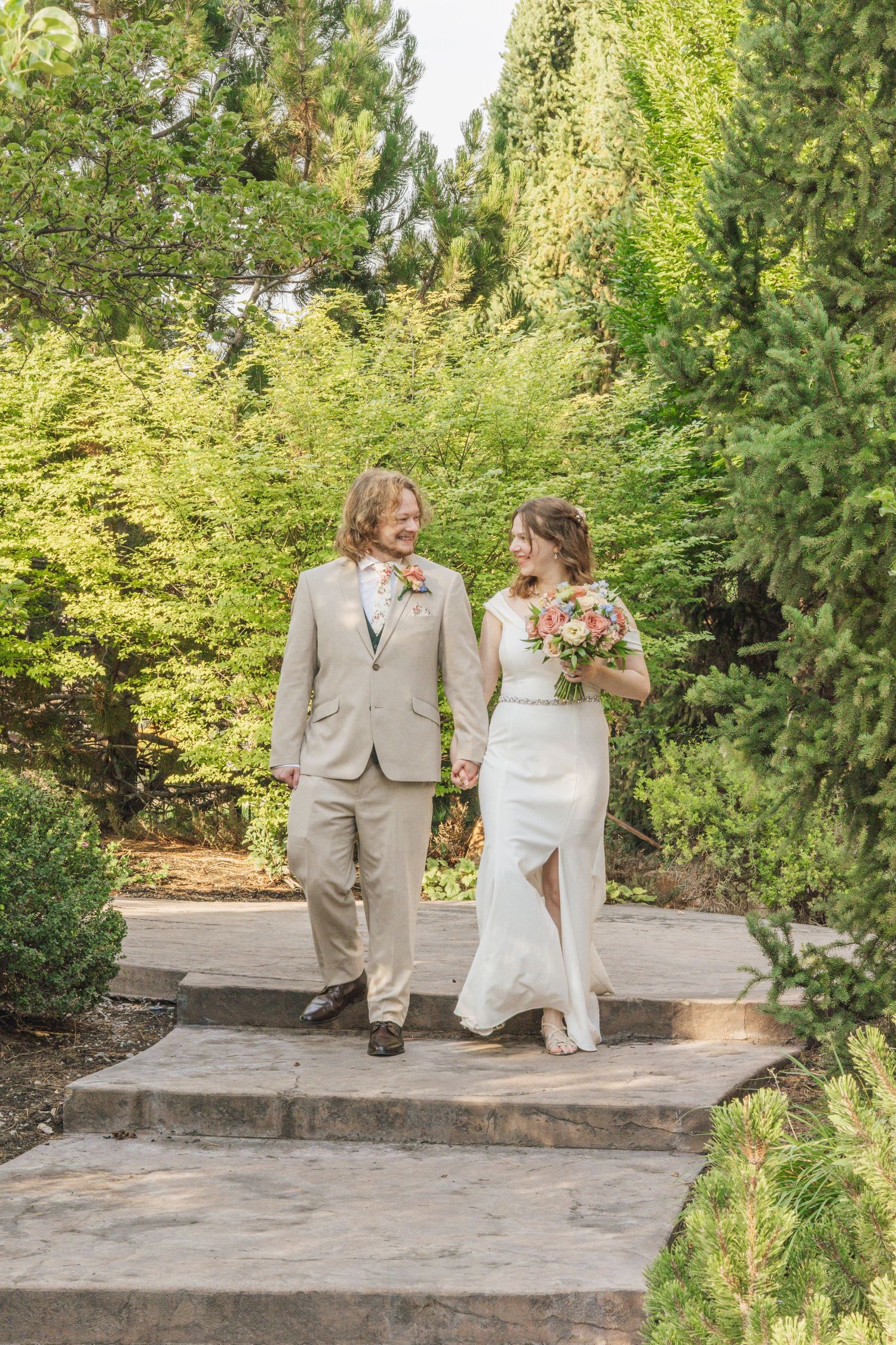 Bride and groom taking their first steps in their marriage in Logan Utah