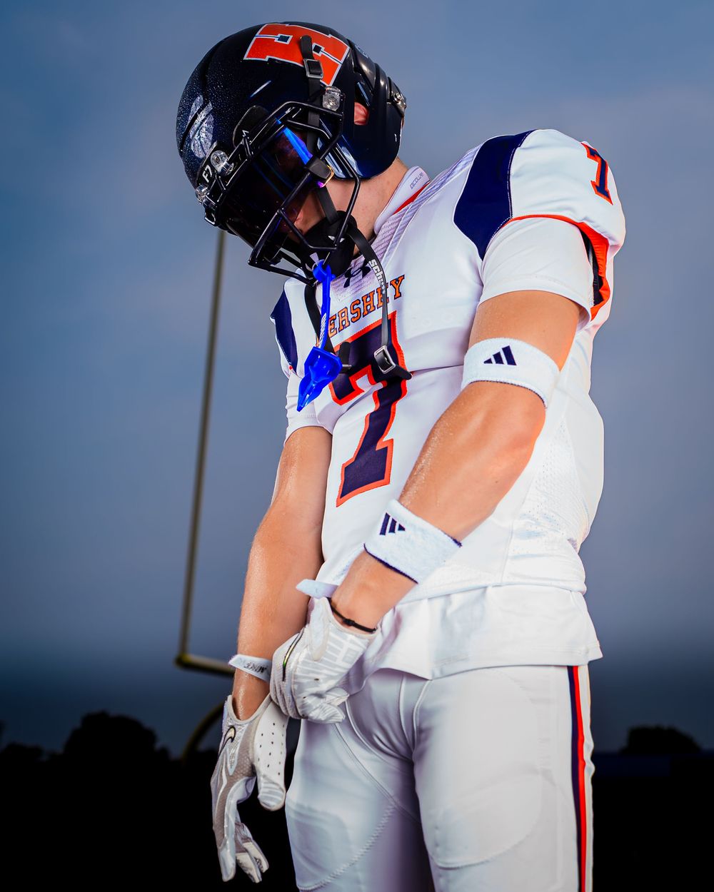 Hershey Trojans football player, helmet on, Media Day portrait, by Deanna Fox, SportsFox Photography based in Hershey PA