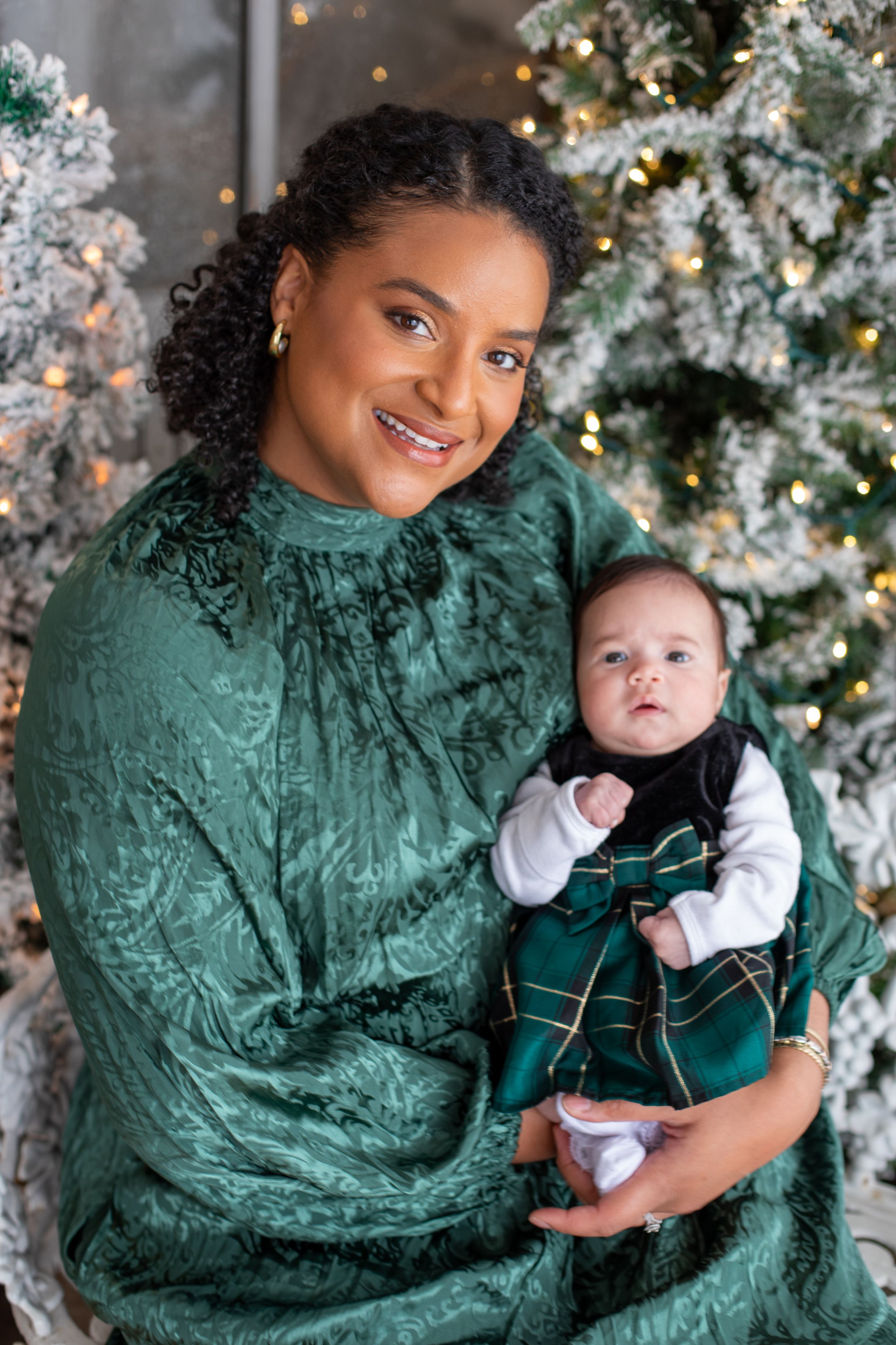Biracial family celebrating Christmas with a child during a 2026 Cincinnati holiday mini session with a local, inclusive photographer.