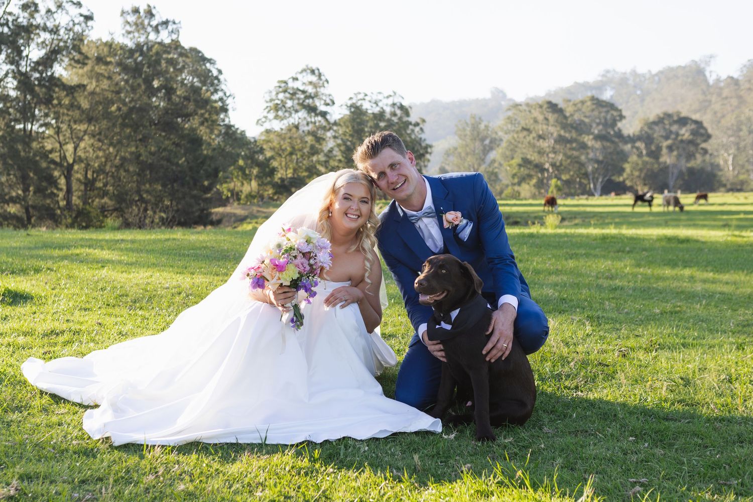 Jess and Lachie’s hugging their dog at Dungog Weddings in Hunter Valley NSW