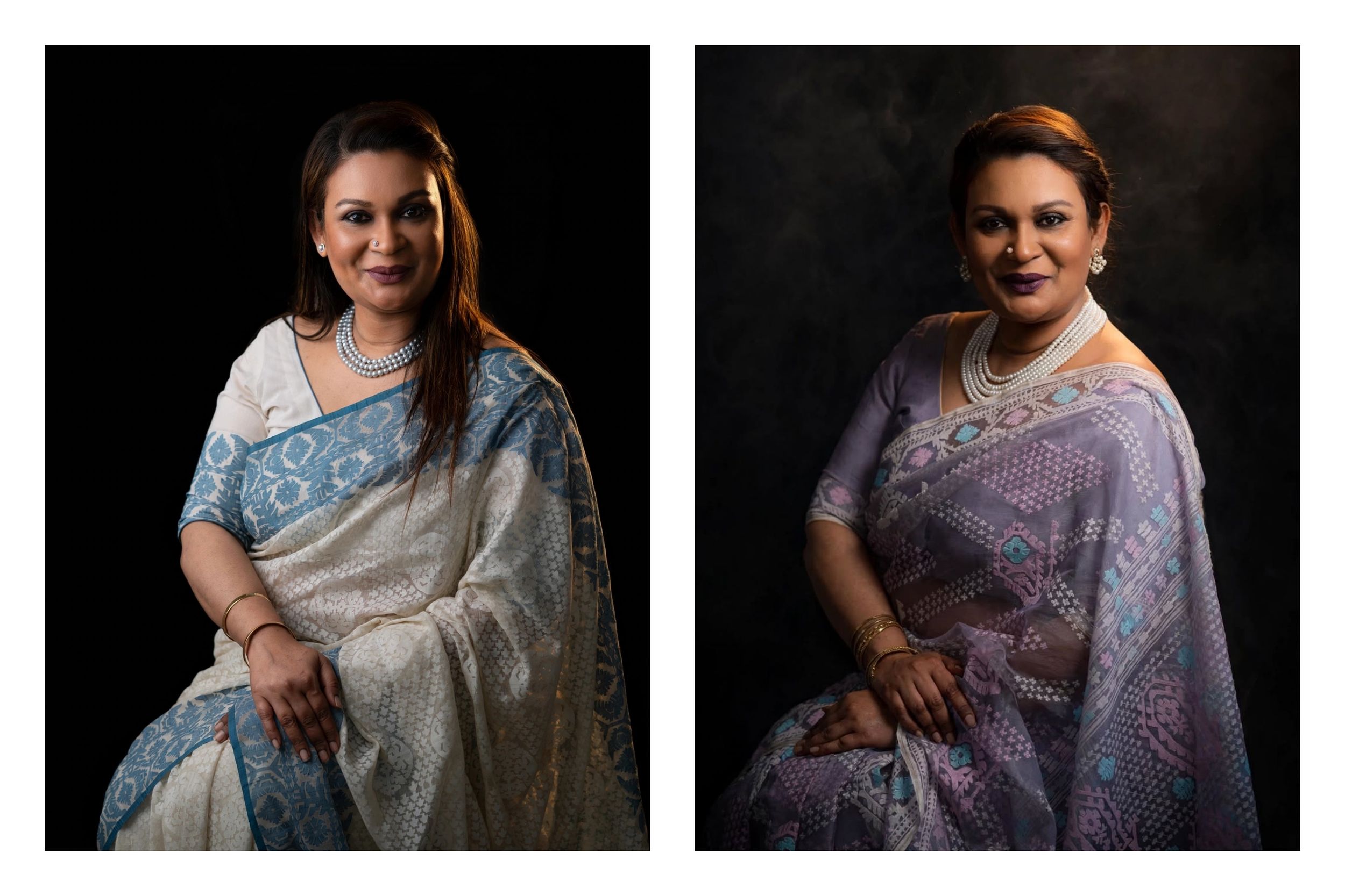 Woman in elegant white and blue saree poses gracefully, alongside another in a lavender floral saree, both wearing pearl necklaces.