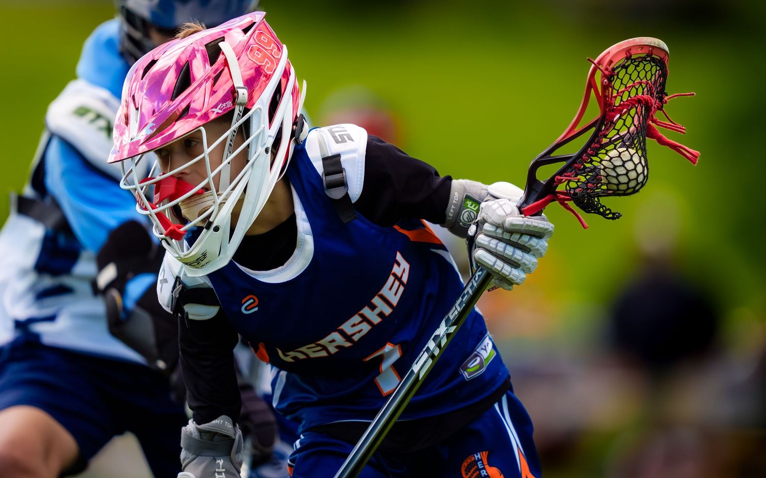 Hershey youth lacrosse player cradling upfield at the Mid Penn Youth Tournament, by Deanna Fox, SportsFox Photography based in Hershey PA