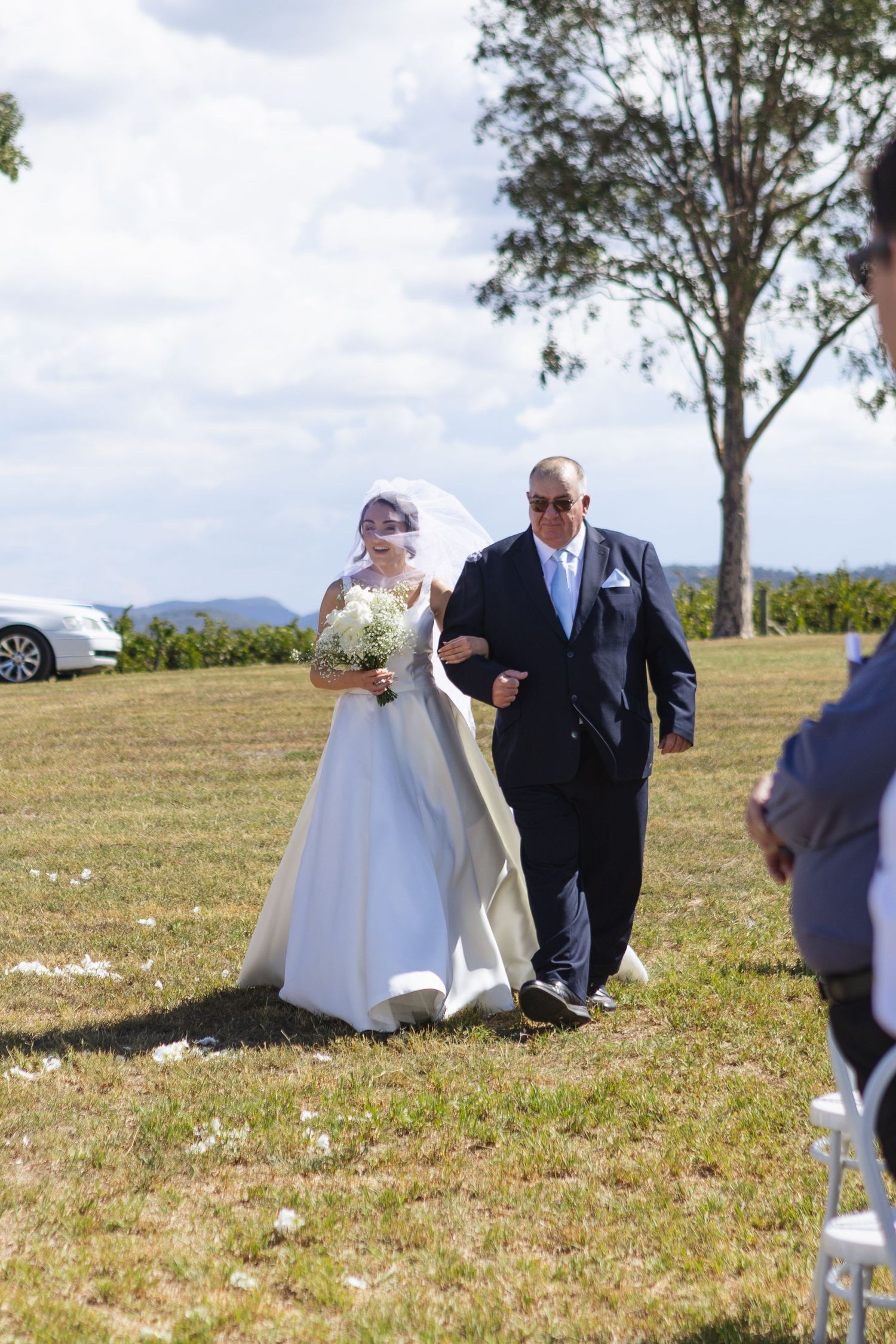 Father of the bride and bride walking down the aisle at Two Rivers Winery Wedding at Denman