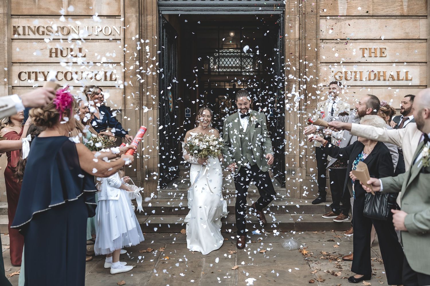 Natural celebrations outside Hull Guildhall captured by documentary wedding photographer