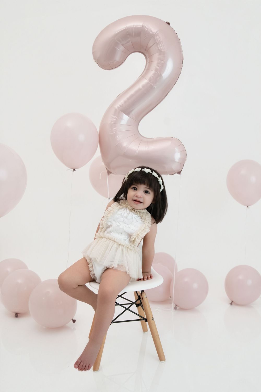 Two year old girl minimalist birthday session pink balloons Nashville