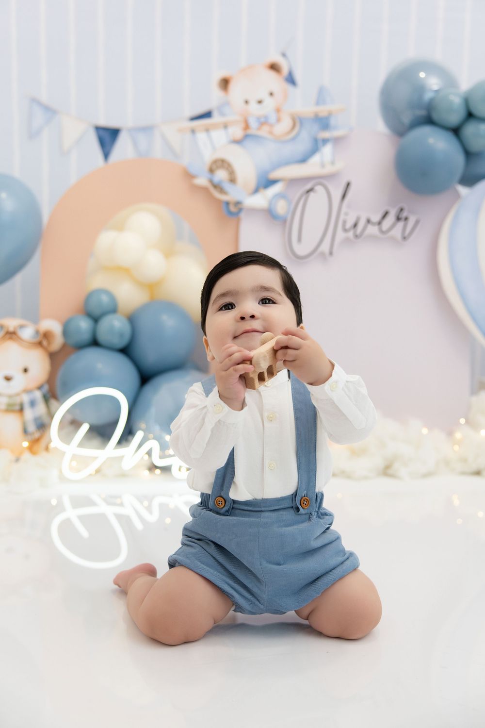 One year old boy blue beige bear pilot clouds themed session Nashville