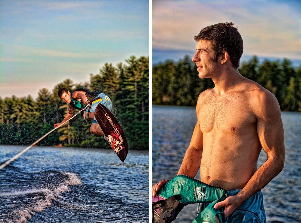 Young man wakeboarding on a lake near pine trees, and posing shirtless holding a wakeboard rope at sunset.