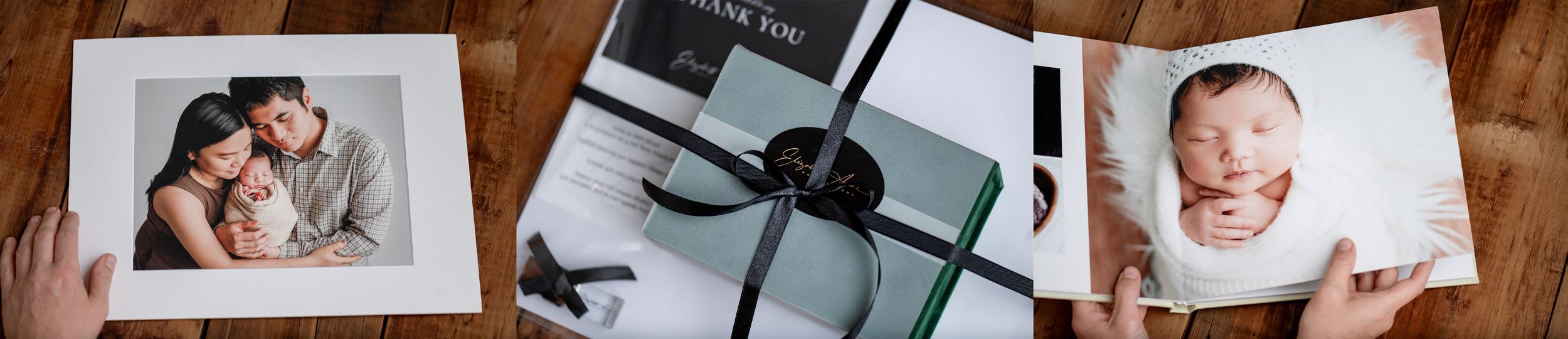 Elegant gift box with black ribbon bow, thank you card, and branded packaging on white background.
