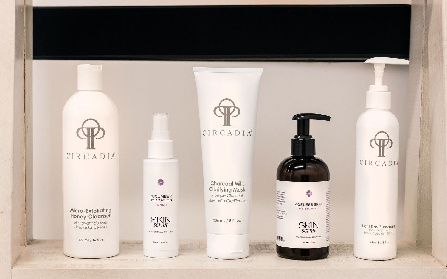 Circadia and Skin Script skincare products displayed on a shelf including cleansers and a charcoal mask.